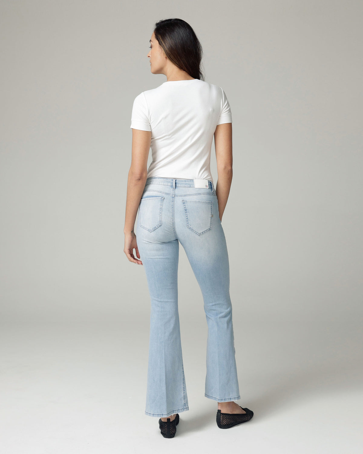 Bleached Blue Flare High-Rise Jeans, The Belly, back view